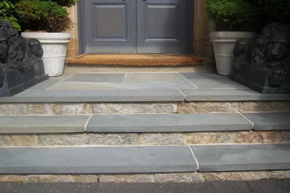 Full color Pennsylvania bluestone step treads at a residential front entry